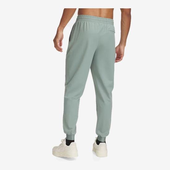 UNDER ARMOUR m hlače 1388823-348 UNSTOPPABLE JOGGERS silica green hydro green